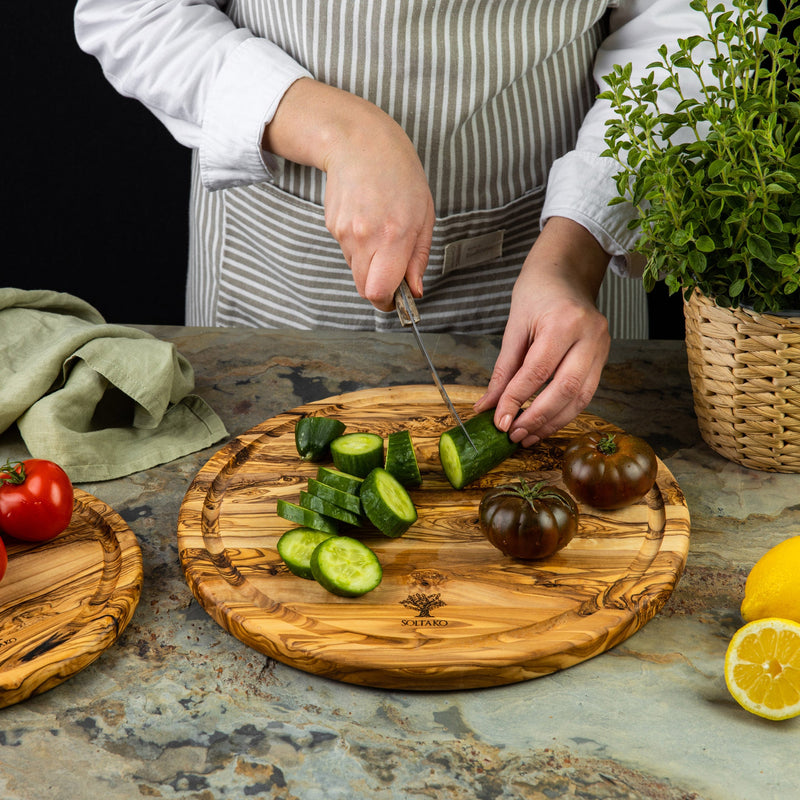 Round cutting board with juice groove "THE RIESENRAD