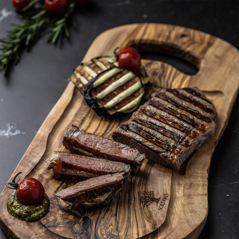 Cutting board with juice groove and handle "CARTHAGE".